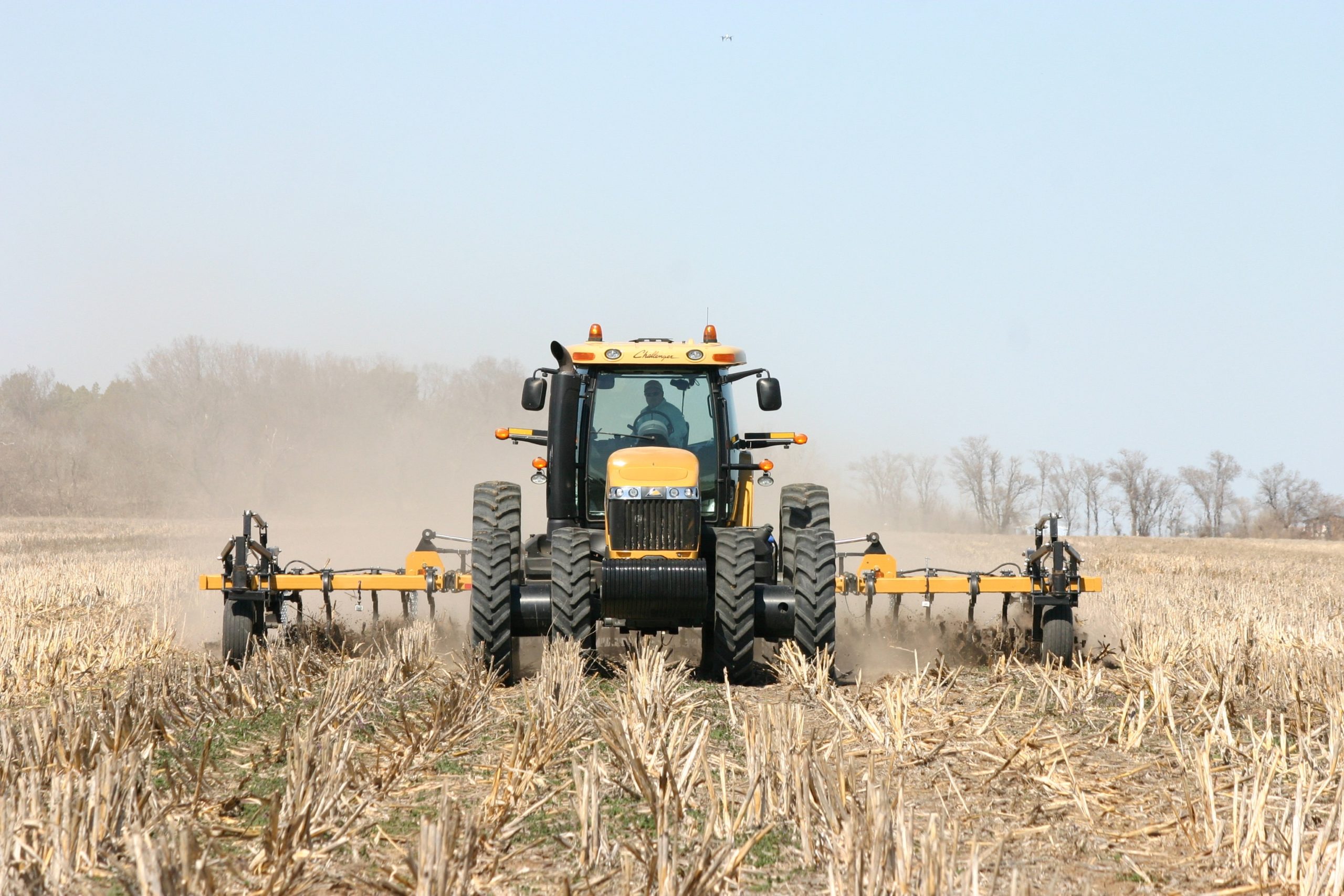 Big Country Chisel Plow in the field pulled behind a tractor